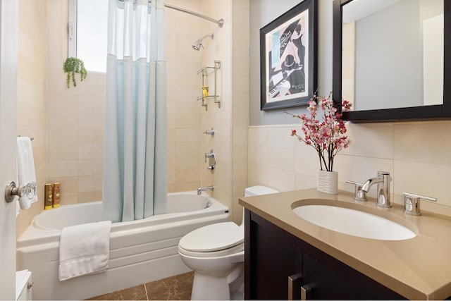 full bath featuring shower / bathtub combination with curtain, toilet, vanity, and tile walls