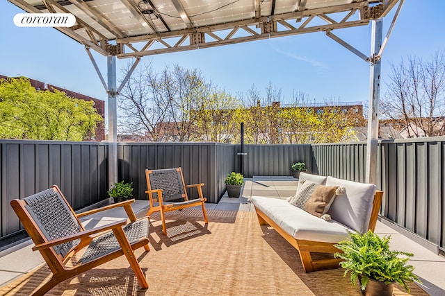 view of patio / terrace featuring an outdoor living space and a fenced backyard