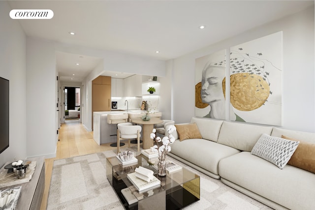 living room featuring light wood finished floors and recessed lighting