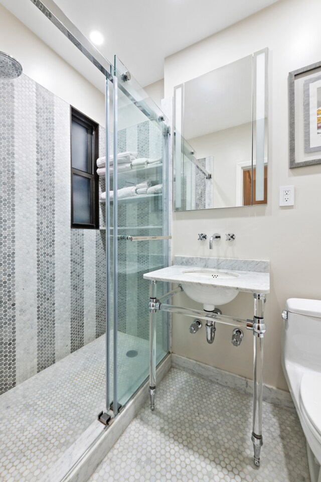 33 E 22nd St Unit 3A, New York City, NY 10010 - full bathroom featuring toilet and a shower stall