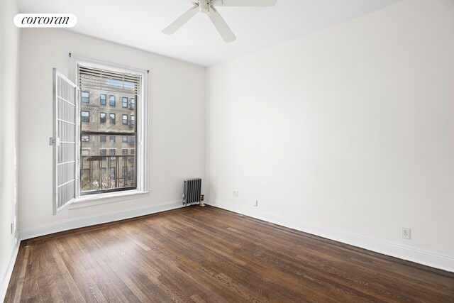 880 W 181st St Unit 4C, New York City, NY 10033 - unfurnished room featuring dark wood-type flooring, radiator, and a ceiling fan
