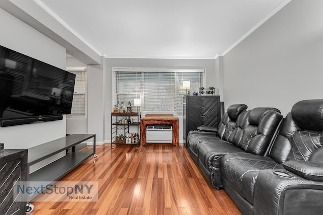 310 E 49th St Unit 2J, New York City, NY 10017 - living room with wood finished floors, crown molding, baseboards, and a wall mounted AC