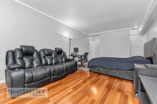 310 E 49th St Unit 2J, New York City, NY 10017 - bedroom with light wood-type flooring and ornamental molding