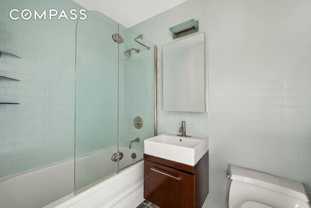 206 E 95th St Unit 10B, New York City, NY 10128 - full bath with tile walls, vanity, enclosed tub / shower combo, and toilet