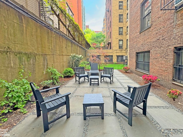 view of patio featuring fence and outdoor lounge area