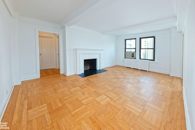 unfurnished living room featuring baseboards, beam ceiling, and a fireplace