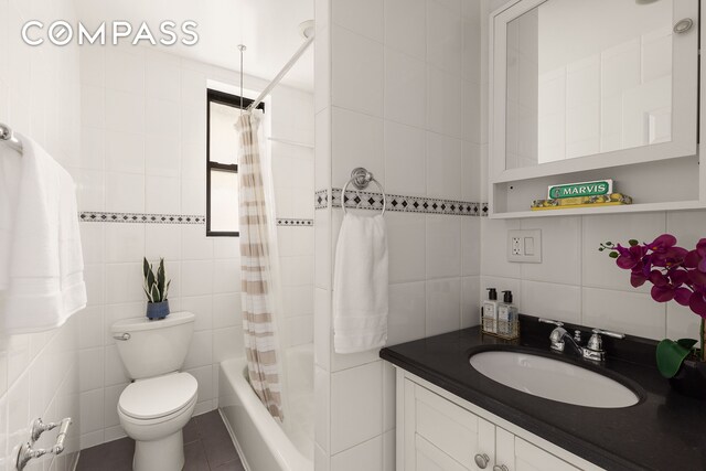801 Riverside Dr Unit 4B, New York City, NY 10032 - bathroom with tile walls, vanity, toilet, shower / bathtub combination with curtain, and tile patterned floors