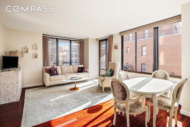 304 E 65th St Unit 10D, New York City, NY 10065 - dining area featuring wood finished floors and baseboards