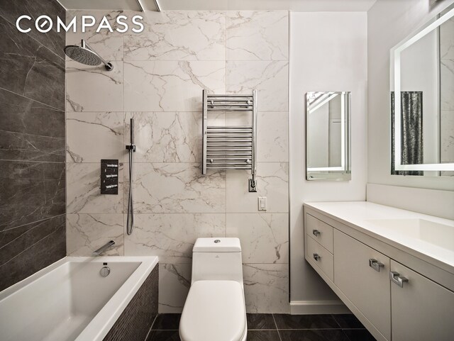 304 E 65th St Unit 10D, New York City, NY 10065 - full bath with radiator, a towel warmer, toilet, vanity, and tiled shower / bath