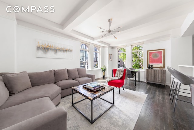 470 W 24th St Unit 2C, New York City, NY 10011 - living room with a chandelier, dark wood finished floors, and baseboards