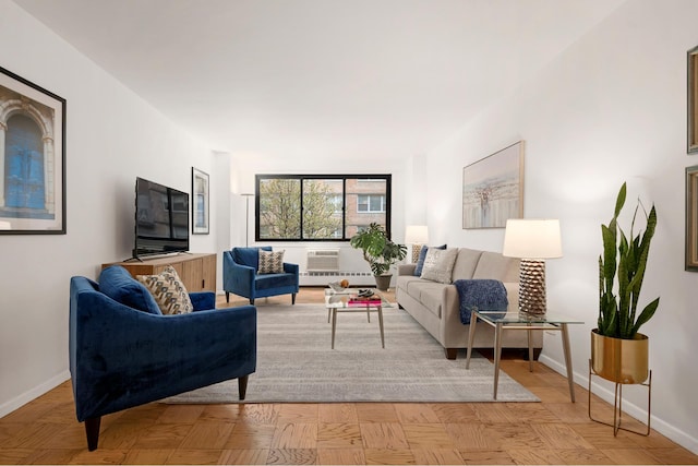 living room featuring baseboards