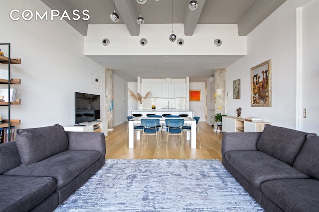 160 Imlay St Unit 4E2, New York City, NY 11231 - living room with light wood-style flooring and beamed ceiling