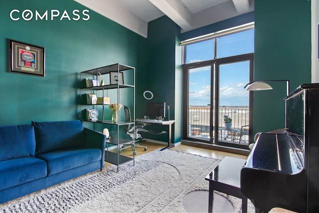 160 Imlay St Unit 4E2, New York City, NY 11231 - living room with an office area, wood finished floors, and beam ceiling