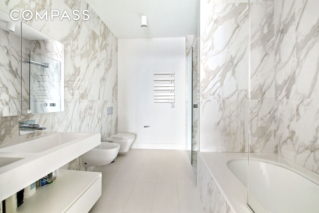 160 Imlay St Unit 4E2, New York City, NY 11231 - full bathroom with toilet, a bidet, a tub with marble appearance, a shower, and tile patterned floors