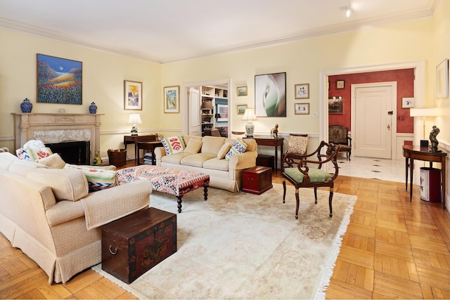 living area with crown molding and a fireplace