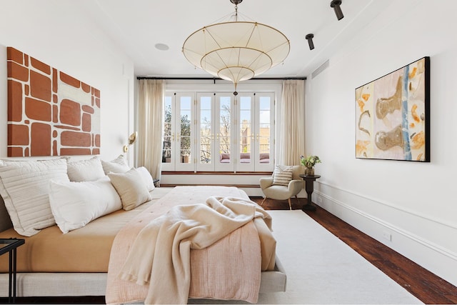 bedroom with wood finished floors