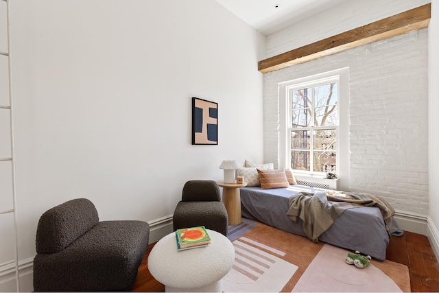 bedroom with baseboards and wood finished floors