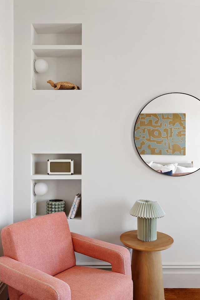 sitting room featuring built in features