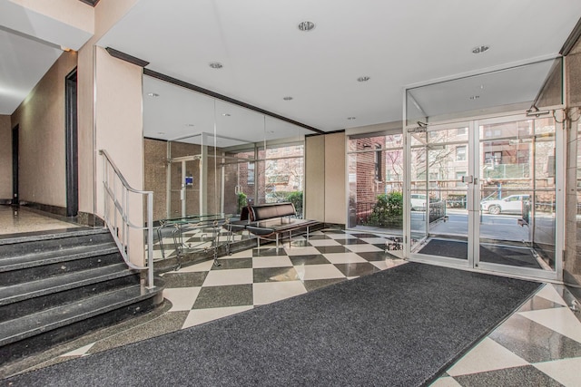 640 W 239th St Unit 1A, New York City, NY 10463 - community lobby with stairs and floor to ceiling windows