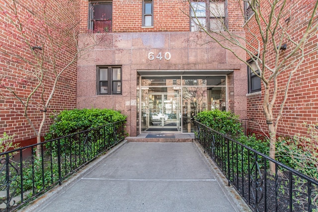 640 W 239th St Unit 1A, New York City, NY 10463 - doorway to property with brick siding