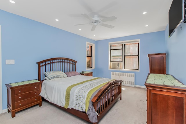 640 W 239th St Unit 1A, New York City, NY 10463 - bedroom featuring radiator heating unit, light carpet, recessed lighting, ceiling fan, and cooling unit