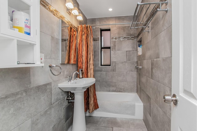 640 W 239th St Unit 1A, New York City, NY 10463 - bathroom featuring shower / tub combo, tile patterned floors, and tile walls