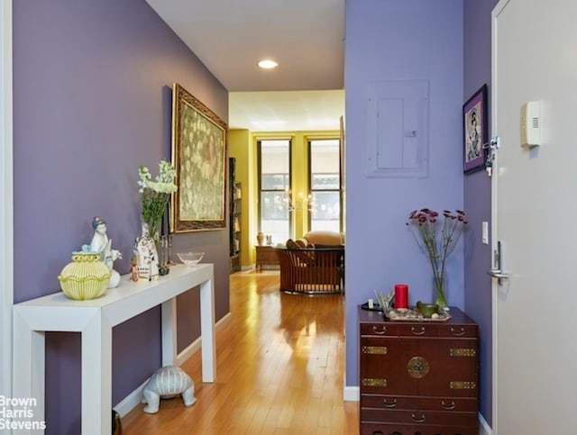 56 Pine St Unit 3B, New York City, NY 10005 - hallway featuring electric panel, light wood-type flooring, baseboards, and recessed lighting
