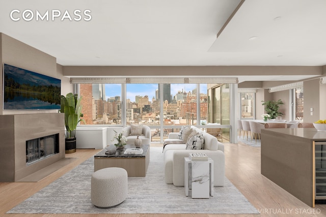 245 W 19th St Unit Ph4, New York City, NY 10011 - living area with wood finished floors and a fireplace