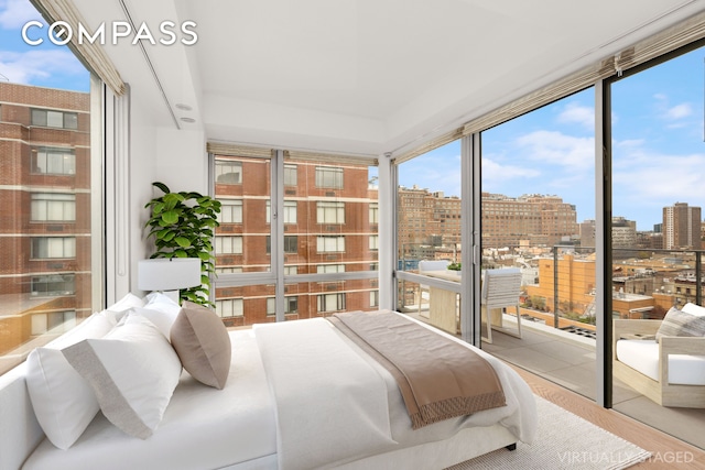 245 W 19th St Unit Ph4, New York City, NY 10011 - bedroom featuring multiple windows, a city view, and access to outside