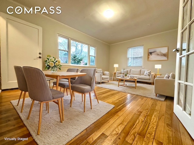 75-66 197th St, New York City, NY 11366 - dining room with ornamental molding, wood-type flooring, and healthy amount of natural light