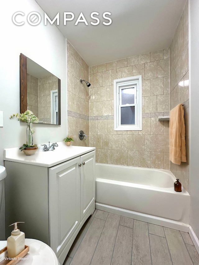 75-66 197th St, New York City, NY 11366 - full bath featuring vanity, wood finished floors, and shower / washtub combination