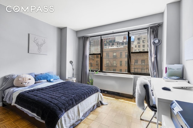 bedroom featuring radiator heating unit