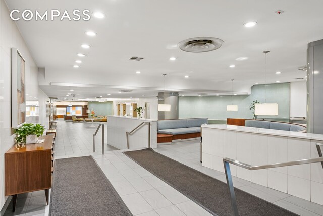 reception featuring recessed lighting