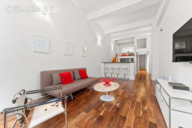 living room with wood finished floors and baseboards