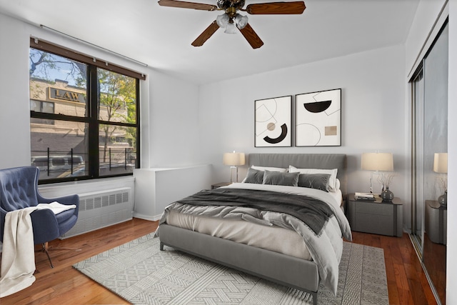 68 Stratford Rd Unit 1A, New York City, NY 11218 - bedroom featuring radiator heating unit, hardwood / wood-style floors, a closet, and ceiling fan