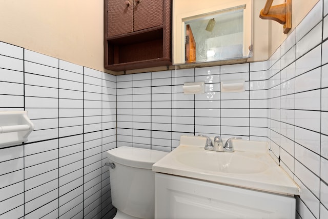 68 Stratford Rd Unit 1A, New York City, NY 11218 - half bathroom featuring tile walls, vanity, and backsplash