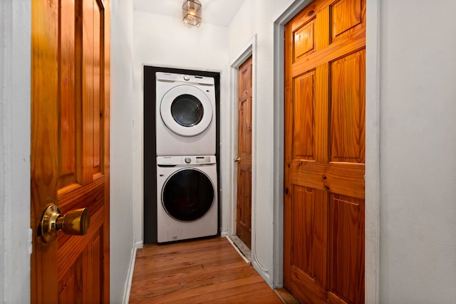 68 Stratford Rd Unit 1A, New York City, NY 11218 - washroom featuring estacked washer and dryer and light wood-type flooring