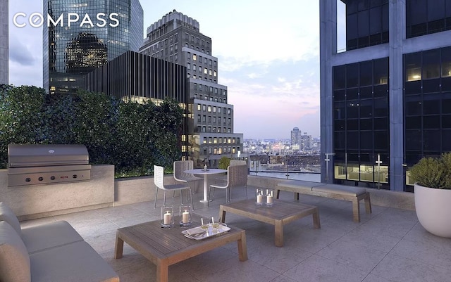 101 Wall St Unit 5Be, New York City, NY 10005 - view of patio featuring a grill, a city view, and an outdoor kitchen