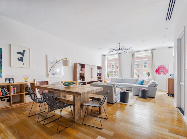 53 Warren St Unit 4, New York City, NY 10007 - dining room with a chandelier and light wood finished floors