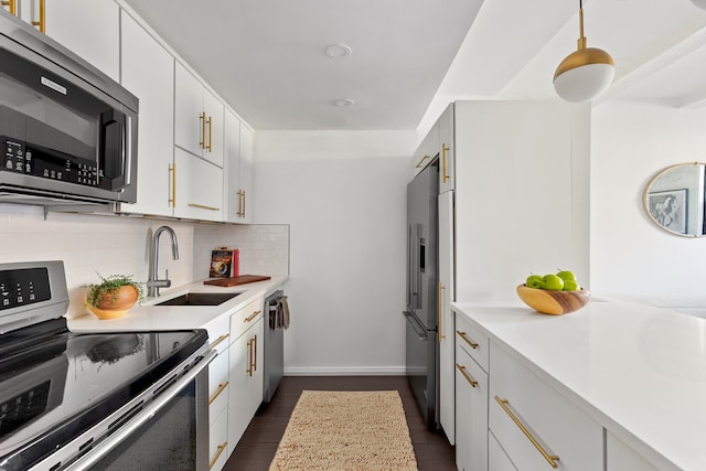 459 12th St Unit A1, New York City, NY 11215 - kitchen featuring stainless steel appliances, a sink, light countertops, and tasteful backsplash