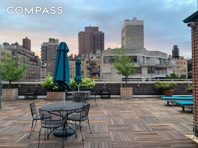 1349 Lexington Ave Unit 8C, New York City, NY 10128 - patio terrace at dusk featuring a skyline view