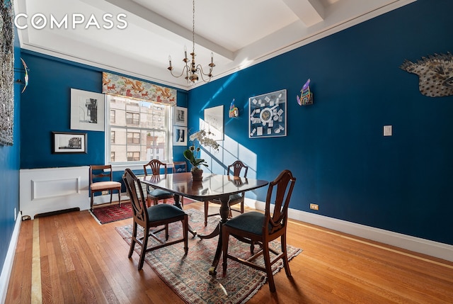 1349 Lexington Ave Unit 8C, New York City, NY 10128 - dining room with hardwood / wood-style floors, a chandelier, beamed ceiling, and baseboards