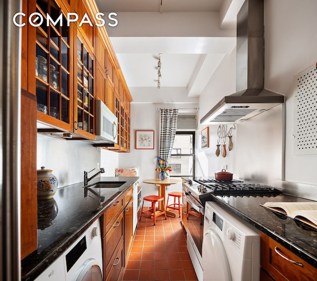 1349 Lexington Ave Unit 8C, New York City, NY 10128 - kitchen with wall chimney exhaust hood, white microwave, washer / clothes dryer, and a sink
