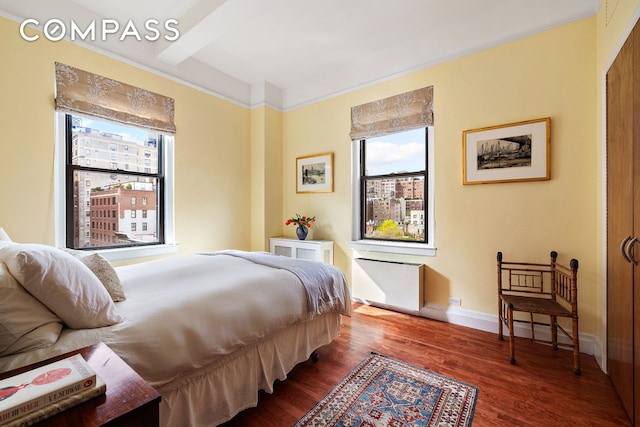 1349 Lexington Ave Unit 8C, New York City, NY 10128 - bedroom with multiple windows, wood finished floors, and baseboards