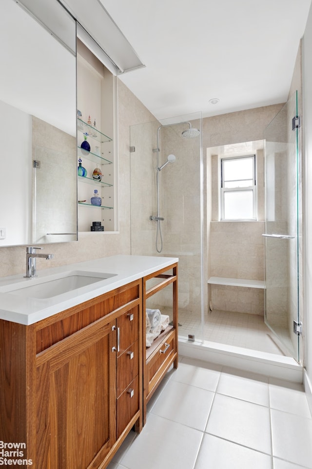 245 W 107th St Unit 4E, New York City, NY 10025 - bathroom featuring vanity, a stall shower, and tile patterned floors