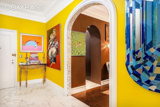 205 W 89th St Unit 6Rs, New York City, NY 10024 - hallway featuring crown molding, arched walkways, marble finish flooring, and baseboards