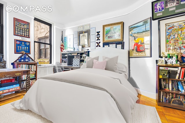 bedroom featuring baseboards