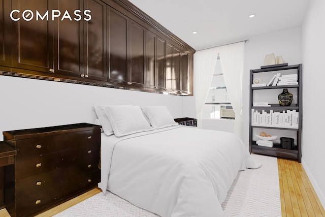 bedroom with light wood-style floors, recessed lighting, and baseboards