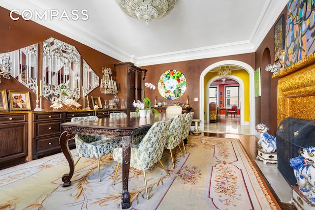 205 W 89th St Unit 6Rs, New York City, NY 10024 - dining room featuring arched walkways, ornamental molding, a chandelier, and light wood-style floors