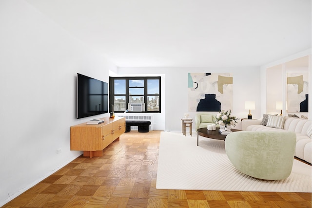 living area with radiator heating unit and baseboards